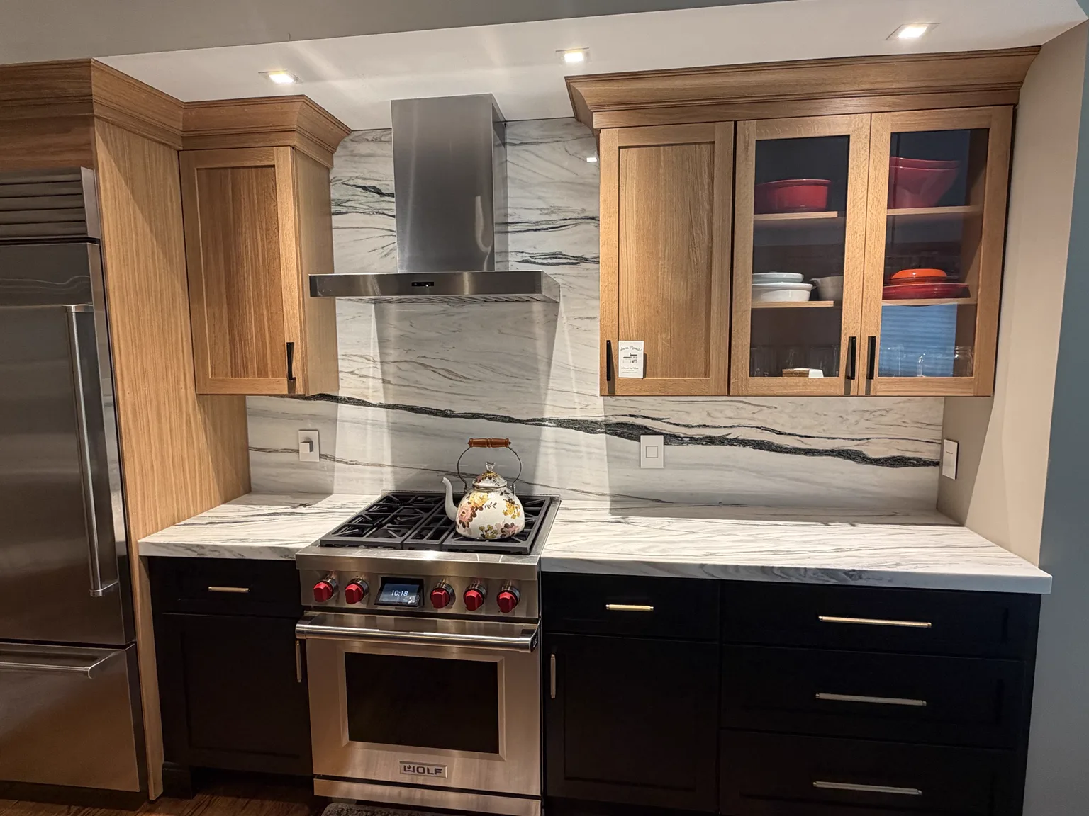 Bianco Lasa full height backsplash behind range in Hudson MA kitchen