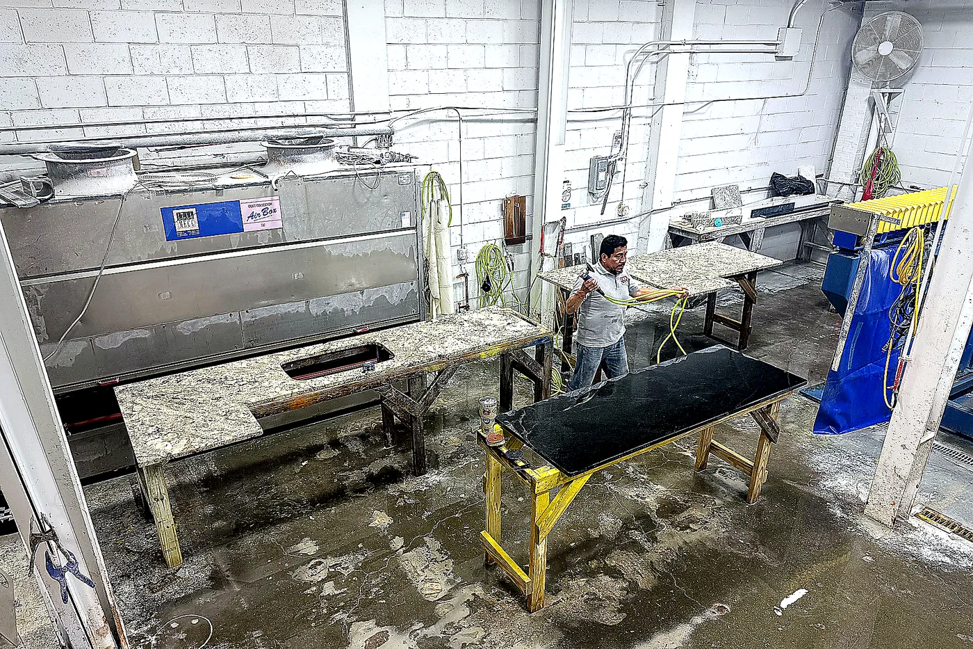 Dream Stoneworks technician working on stone in the fabrication shop