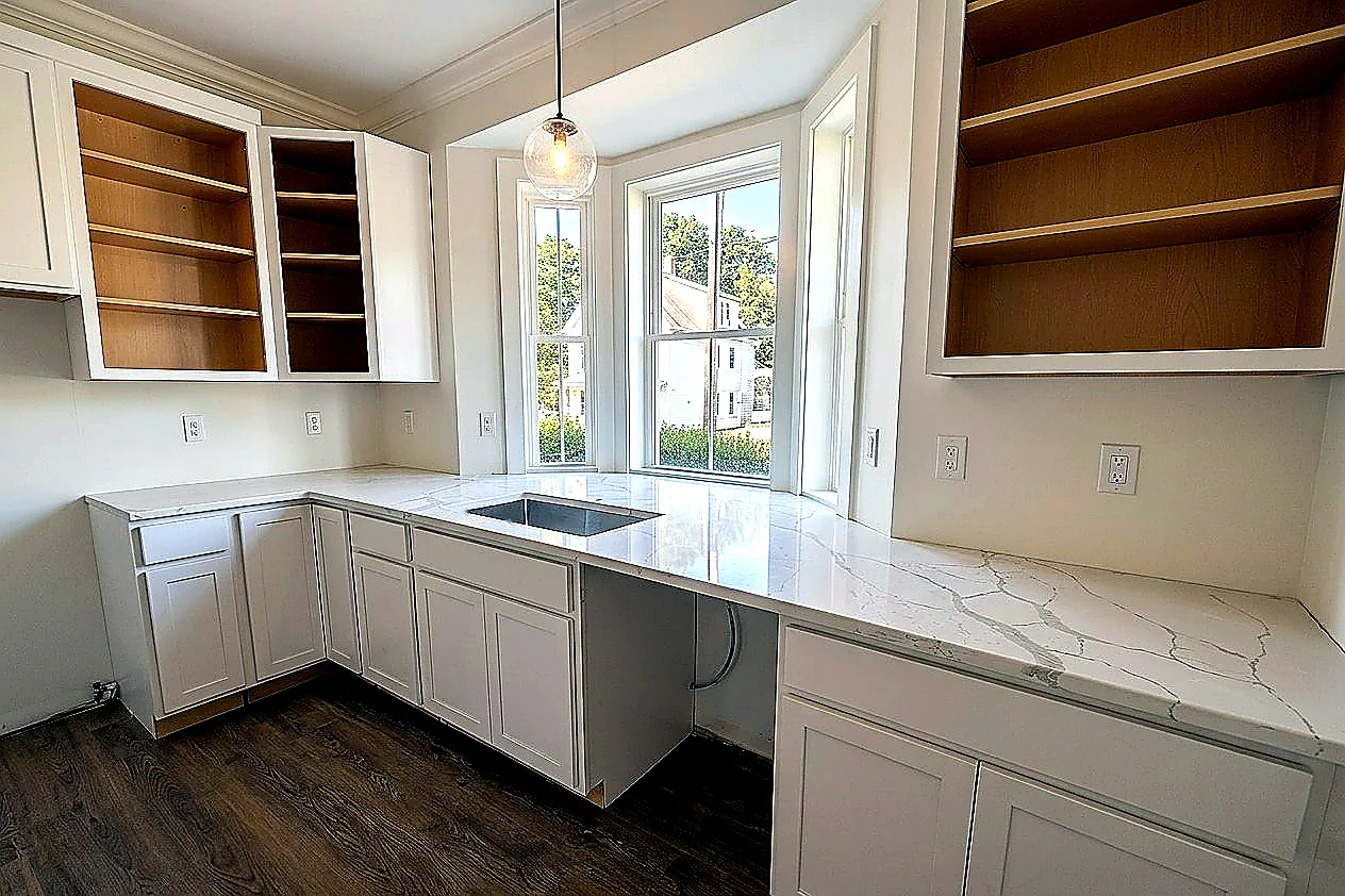 Completed white countertop installation in a Massachusetts kitchen by Dream Stoneworks