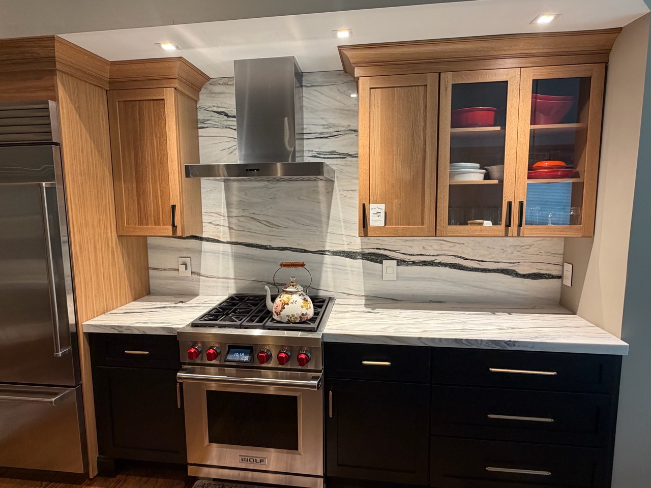 Finished countertops and full-height backsplash around a kitchen range in Marlborough, Massachusetts